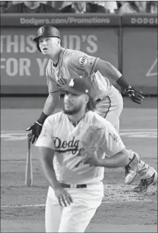  ?? Mark J. Terrill Associated Press ?? KENLEY JANSEN gave up a home run to the Giants’ Joe Panik in his first appearance, the first sign that something might be amiss.