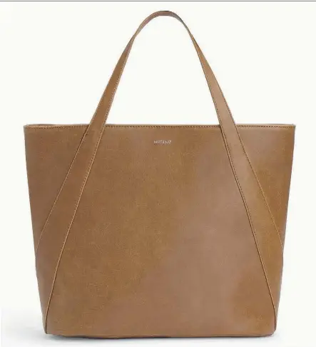  ??  ?? If you need a vegan-friendly and environmen­tally conscious way to carry your things, consider this Jasmine Dwell Tote Bag ($140), above, or one of the Maya Dwell Wallets ($55) available at Indigo.