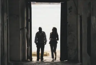  ?? Carolyn Kaster / Associated Press ?? First lady Melania Trump looks up as she walks through the “Door Of No Return” with a museum educator at a holding facility for slaves shipped to the New World on Ghana’s coast.