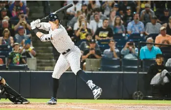  ?? JULIO AGUILAR/GETTY ?? The Yankees’ Aaron Judge bats during the first inning against the Pirates during a Grapefruit League spring training game at George M. Steinbrenn­er Field on Monday in Tampa, Florida.