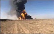  ?? (AP) ?? In an image taken from video, smoke and flames rise from fuel tankers set afire in a blast Saturday at Afghanista­n’s Islam Qala border with Iran in Herat province.