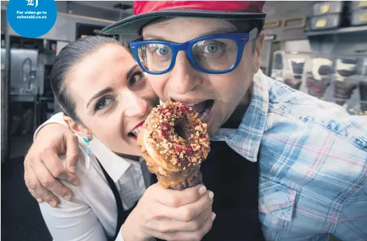  ?? Picture / Jason Oxenham ?? For video go to nzherald. co. nz Anna and Giapo Grazioli share one of their creations, a donut- topped chocolate and nut icecream.