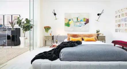  ?? JDK INTERIORS PHOTOS: RYAN DAUSCH/ ?? It takes a careful touch, but homeowners can consider moving a piece of art they already own — such as this striking piece in a bedroom designed by Jenny Kirschner — from one room to another as a cost-free way of redecorati­ng their space for a...