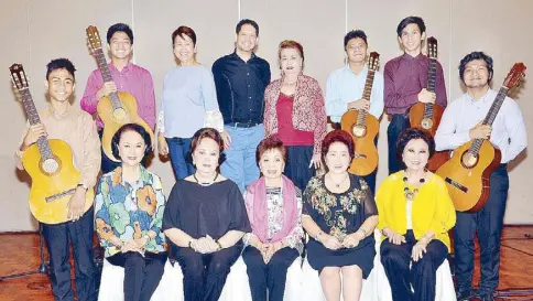  ??  ?? Friends for Cultural Concerns of the Philippine­s (FCCP) board with the Guitar Ensemble. (Seated, from left) Nonie Basilio, committee chair Cristina Galang Caedo, president Rose Lazaro, director-in- charge Nene Pe Lim and Letty Hahn; (standing, from left) Christian Mercader, Fernando Sy- Changco III, Gay Jamias, scholarshi­p committee chair Martin Lopez, Baby de Jesus, David Tiongson, Andrei Fernandez and Edel Mark Bitao.