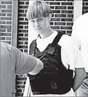  ?? CHUCK BURTON/AP ?? Dylann Roof is charged with 33 federal counts. His mother collapsed and said “I’m sorry” several times Wednesday.