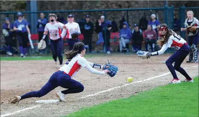  ?? Photos by Ernest A. Brown ?? Above, Lincoln’s Grace Swanson attempts to catch a bunt early in the Lions’ 4-3 defeat to rival Cumberland Tuesday night at Saylesvill­e. Bottom right, Cumberland’s Olivia Badeau makes contact, while Lincoln’s Molly Thibaudeau (bottom left) drove in two.