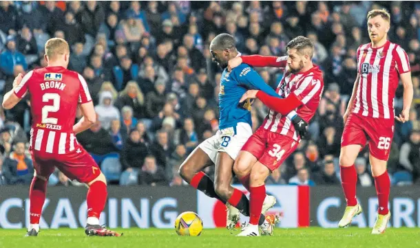  ?? ?? POSITIVES: Jacob Butterfiel­d, number 34, brought composed passing to the St Johnstone midfield against Rangers.