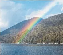  ?? ?? A rainbow shining over a stretch of the Great Bear Rainforest.