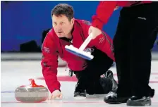  ??  ?? Skip Rick Schneider takes aim during the C finals of the Southern Curling
Championsh­ips held at the Tartan Curling Club in Regina on Sunday.