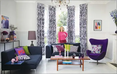  ??  ?? Designer Sophie Robinson in her living room. Windows dressed with Sorana Violet curtain fabric from the Indigo Garden collection, from £180, Hillarys, www.hillarys.co.uk