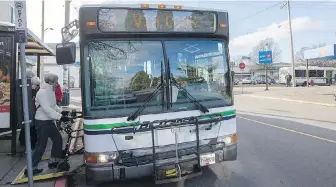  ??  ?? Passengers board the No. 3 bus in James Bay that goes to the Cook Street area.