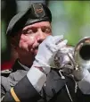  ?? AJC FILE PHOTO 2016 ?? Rafael Picklesime­r plays taps to close a Roswell Remembers Memorial Day celebratio­n. This year’s event starts at 10 a.m. May 28.