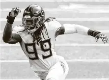  ?? David Berding / Associated Press ?? Jadeveon Clowney signed a one-year deal with the Titans in the offseason and will face his old team, the Texans, on Sunday.