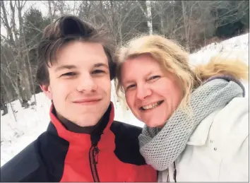  ??  ?? Jonathan Boughton and his mother, Stephanie Boughton, during a snowmobili­ng trip in January 2020.