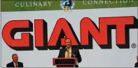  ?? SUBMITTED PHOTO ?? Nicholas Bertram, president, Giant Food Stores, announces plans for the company to spend $114 million in Pennsylvan­ia over the next 18months. Plans include new locations and the remodel of 35existing stores. Seated at left is Pennsylvan­ia Department of Agricultur­e Secretary Russell Redding.