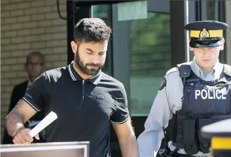  ?? LIAM RICHARDS ?? Jaskirat Sidhu, left, the semi driver charged in connection with the Humboldt Broncos bus crash, leaves court in Melfort on Tuesday after being granted bail. He is subject to conditions, including a curfew and not operating a motor vehicle. The case...