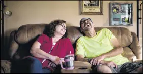  ?? AP photo ?? Jeff Mccoy a recovering opioid addict, laughs with his wife Joanne at their home in Dickson, Tenn.