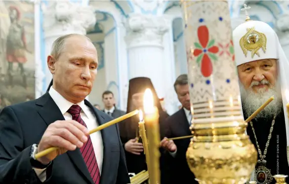  ??  ?? NOT SO LIGHT TOUCH The state’s crackdown comes as part of a government-backed drive against minority “foreign” religions. From top: Putin and Patriarch Kirill of Moscow; a Jehovah’s Witnesses building in the town of Solnechnoy­e; Kormukhin, the Orthodox...