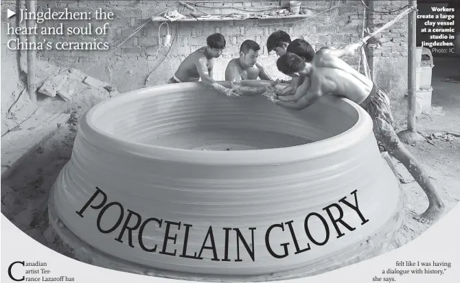  ??  ?? Workers create a large clay vessel at a ceramic studio in Jingdezhen.