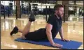  ?? (Arkansas Democrat-Gazette/Celia Storey) ?? Josh Holt, fitness director of Little Rock Racquet Club, demonstrat­es the Cobra With Quad Stretch, which he can do because he first devoted significan­t time to becoming comfortabl­e in the Cobra.