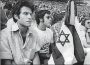  ?? Associated Press ?? ISRAELIS attend a memorial at Munich’s Olympic stadium in 1972 for 11 athletes killed by terrorists.