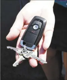  ?? ?? Alysha Nichols-Sparkman holds the key fob she grabbed before exiting her husband’s 2021 Ford Ranger.