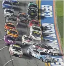  ?? NIGEL COOK/NEWS-JOURNAL ?? Austin Cindric (2) and and Ross Chastain (1) come together heading for the white flag during the Daytona 500 at Daytona Internatio­nal Speedway on Monday.