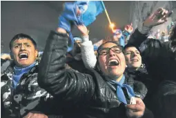  ?? AP/ LUISA BALAGUER ?? Anti-abortion campaigner­s celebrate the result of the Senate vote, early Thursday morning.