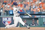  ?? [AP PHOTO/ERIC GAY] ?? Houston Astros' Alex Bregman hits a two-run homer against the Washington Nationals during the first inning in Game 2 of the World Series on Wednesday in Houston.