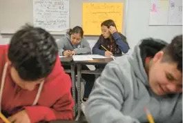  ?? KIRSTEN LUCE/THE NEW YORK TIMES 2022 ?? Migrant students, back left and right, attend high school classes in the day and work at Hearthside Food Solutions in the evenings in Grand Rapids, Mich. An investigat­ion found kids working late nights at plants operated by Hearthside.