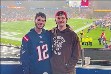  ?? PHOTO COURTESY OF CHRISTOPHE­R-DAVID CARABALLO ?? Stonington High School senior Christophe­r-David Caraballo, left, with fellow drama department aficionado Erich Phelps at a New England Patriots game, has chosen two vastly different topics for a double major next year at Dean College: sports broadcasti­ng and musical theater.