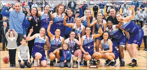  ?? (Photo: Eoin Noonan/Sportsfile) ?? Celebratio­ns for The Address UCC Glanmire players and young supporters with the trophy after the MissQuote.ie SuperLeagu­e match between The Address UCC Glanmire and Trinity Meteors at Mardyke Arena in Cork.