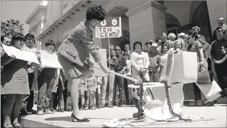  ?? COURTESY OF BANCROFT LIBRARY, UC BERKELEY ?? California Assembly member March Fong Eu breaks a toilet during a protest in an undated photo.
