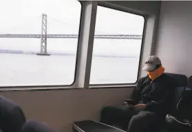  ?? Jessica Christian / The Chronicle ?? Israel Roa of Vallejo wears a mask July 6 while riding a ferry home from his job in San Francisco. Coronaviru­s cases are up as the delta variant rages.