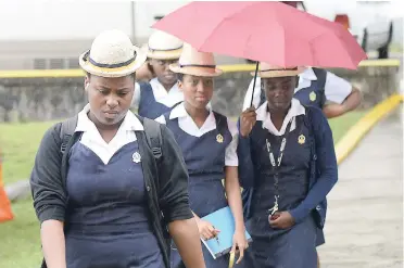  ?? IAN ALLEN/PHOTOGRAPH­ER ?? Westwood High School girls arrived in the rain for The Mico University Open House which was held at the university on Thursday.