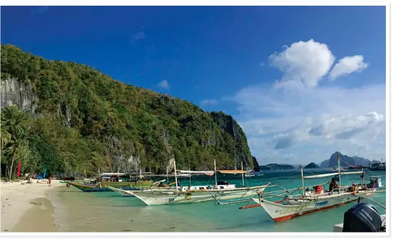  ??  ?? This is Papaya Beach on Palawan Island, a popular stopover when you’re island-hopping. The Bacuit archipelag­o is on the north-western tip of Palawan with more than 45 limestone islands set in clear blue waters. Most of the beaches are untouched.