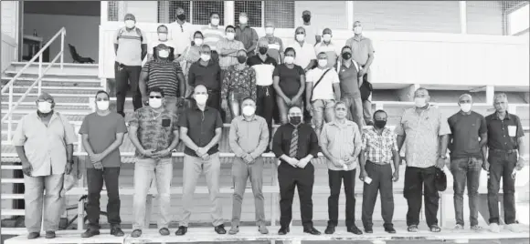  ??  ?? Members of the Guyana Cricket Board executive, standing in front with representa­tives from the three County Boards positioned behind.