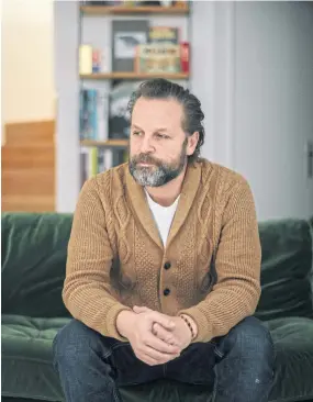  ??  ?? Designer Joachim Roncin, author of the ‘Je Suis Charlie’ slogan, at his home in Paris on Dec 12.