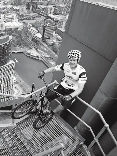  ??  ?? LEFT: POLISH TRIALS STAR KRYSTIAN HERBA ’CLIMBED’ THE 2 919 STEPS OF THE EUREKA TOWER IN 2014 WITHOUT STOPPING, OR USING HIS HANDS, ARMS OR FEET TO STEADY HIMSELF, IN AN HOUR AND THREE-QUARTERS OF NON-STOP HOP. IMPORTANT TECH NOTICE: NO SADDLE!