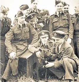  ??  ?? The Dambusters’ dog with Wing Commander Guy Gibson, front right