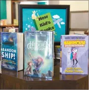  ?? Donnis Hueftle-Bullock ?? Kids, take a look at the books available for you at your local library, like these at the Broken Bow Public Library. Also, look on page A2 to find out how you can get a free Dairy Queen ice cream cone!