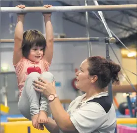  ??  ?? STEP UP: Natimuk and District Gymnastic Club coach Drew Fraser with Step into Gym participan­t Matilda Stanley. Picture: PAUL CARRACHER