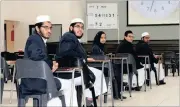  ??  ?? Half way through… Orient Islamic pupils Tal’ha Khan, from back, Muzffar Malani, Mishkah Arbee, Muhammed Khan and Mohammed Roussoulle wrote Physics Paper 2 on Monday.