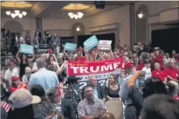  ?? DOUG MILLS — THE NEW YORK TIMES ?? Attendees cheer as President Donald Trump arrives for a Latinos for Trump Coalition roundtable campaign event in Phoenix in September.