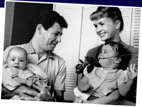  ??  ?? Fleeting father: Debbie and Eddie with Todd and Carrie in 1958
