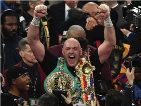  ??  ?? Tyson Fury celebrates after defeating Deontay Wilder. Photograph: Mark Ralston/AFP via Getty Images