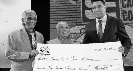  ?? CONTRIBUTE­D ?? Prime Minister Andrew Holness (right) presents a symbolic cheque in the sum of $400,000 to Jamaica Social Stock Exchange Chairman, Professor Neville Ying and Jamaica Stock Exchange (JSE) Managing Director Marlene Street Forrest during the 15th JSE Regional Investment and Capital Markets Conference, held at The Jamaica Pegasus hotel in New Kingston on Tuesday. Holness was the keynote speaker. The conference was held under the theme ‘The Winds of Change: Capital, Innovation and Technology’.