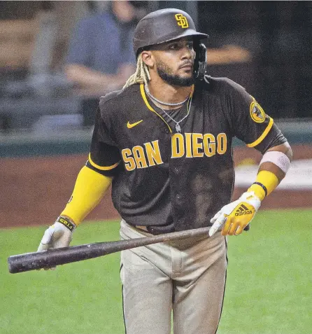  ?? JEROME MIRON/ USA TODAY SPORTS ?? Fernando Tatis Jr. watches the flight of a grand slam, one of his MLB- leading 12 homers.