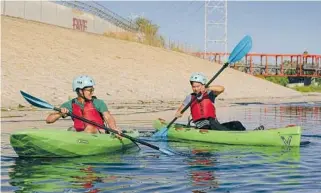  ?? ?? THOMSON DRYJANSKI navigates rapids, top, and Nathan and Kyle Lin enjoy a calmer section on the L.A. River Kayak Safari.