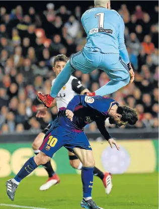  ?? Picture: AFP ?? UNBENDING MAESTRO: Valencia goalkeeper Jaume leaps over Barcelona forward Lionel Messi during the Spanish ‘Copa del Rey’ (King’s Cup) second leg semifinal match at the Mestalla stadium in Valencia. Chelsea manager Antonio Conte has praised Messi